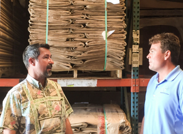 Two employees talking in warehouse